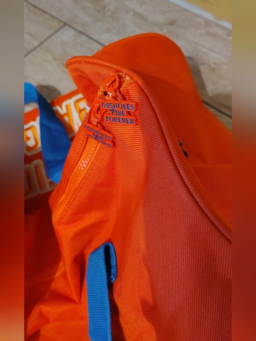 Emotional Baggage Orange Duffel Bag with Blue Handles